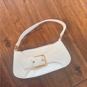 Brand new white purse with gold buckle